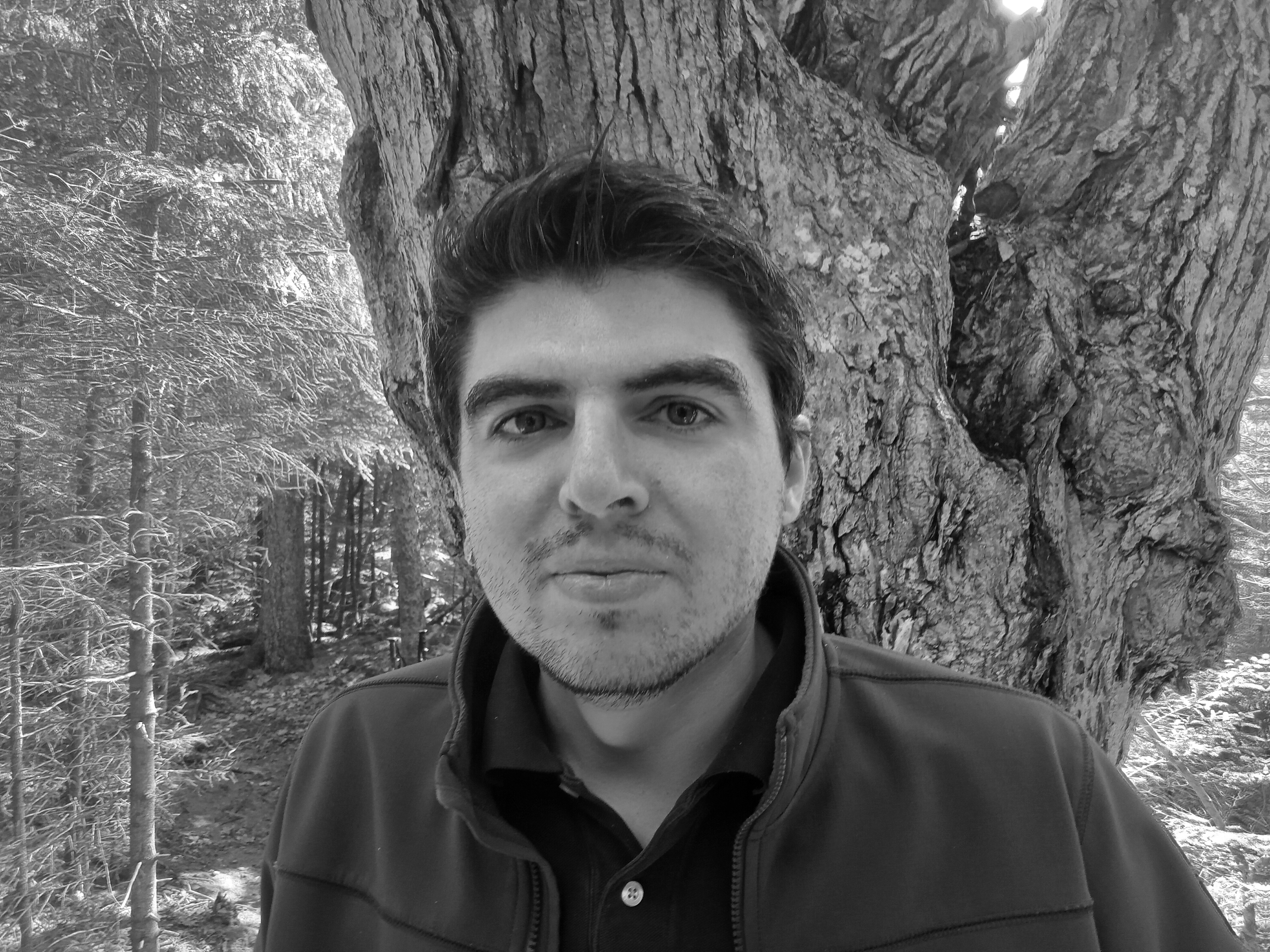 Black and white image of Massif MSP's founder in woods.